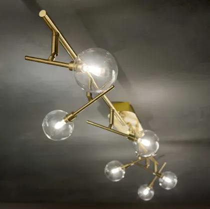 Lampada da parete Maracas in metallo rifinito in ottone satinato con diffusori orientabili in vetro soffiato trasparente di Ideal Lux